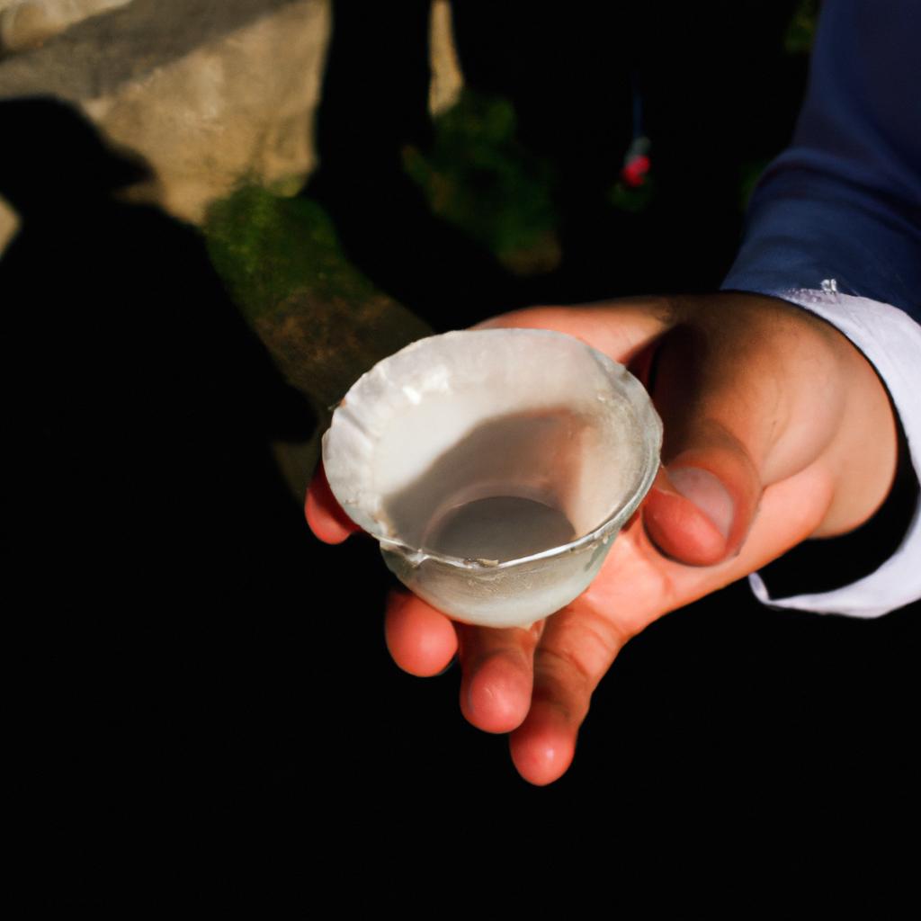 Person holding a communion cup