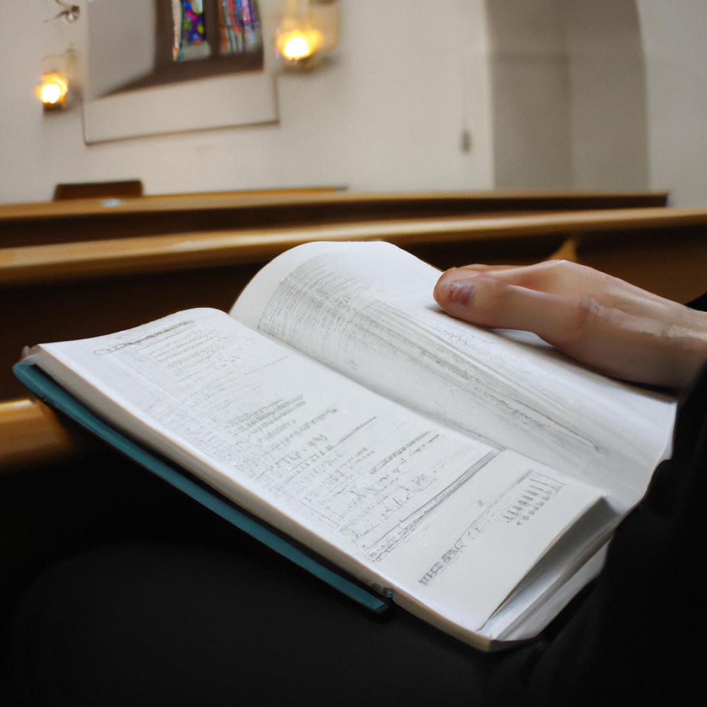Person studying Bible in church