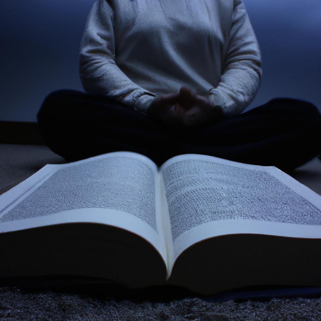 Person meditating with open Bible
